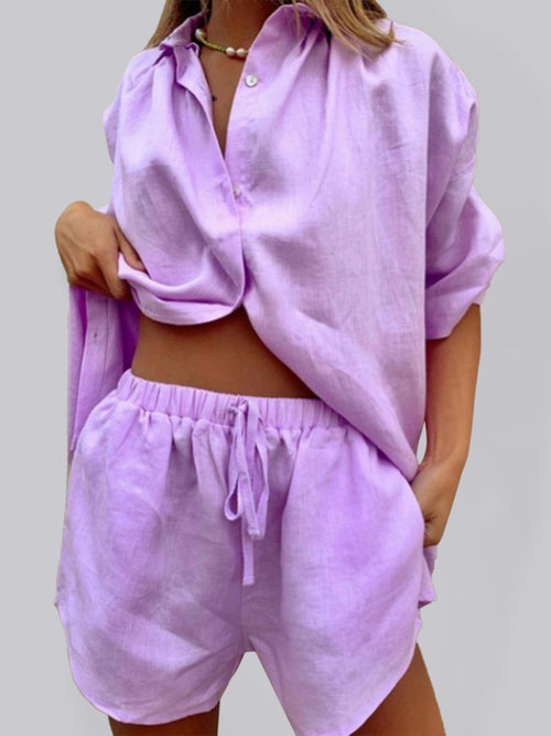 Women's button-up shirt and shorts set in light purple, featuring a loose-fit design, perfect for summer style.