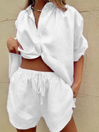 Women's button-up shirt and shorts set in white, featuring a loose-fit design and casual summer style.