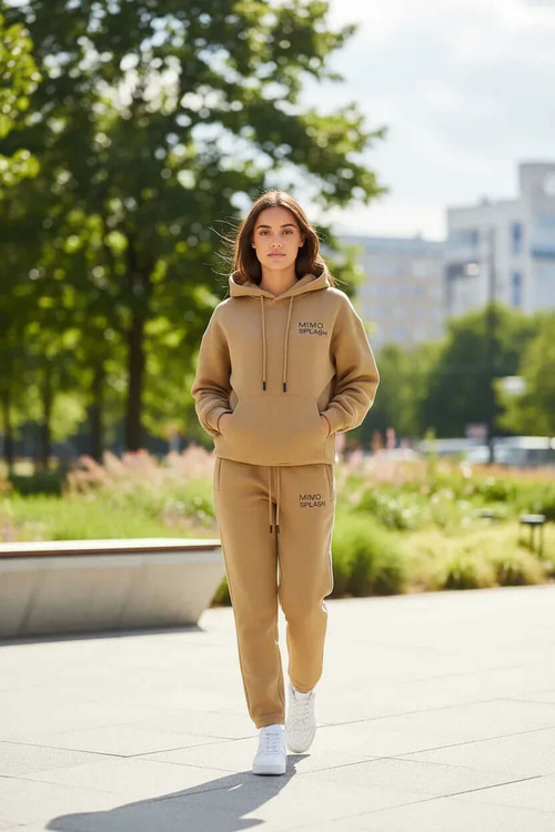 Women's beige tracksuit set featuring a casual hoodie and joggers, perfect for comfortable outings and casual wear.