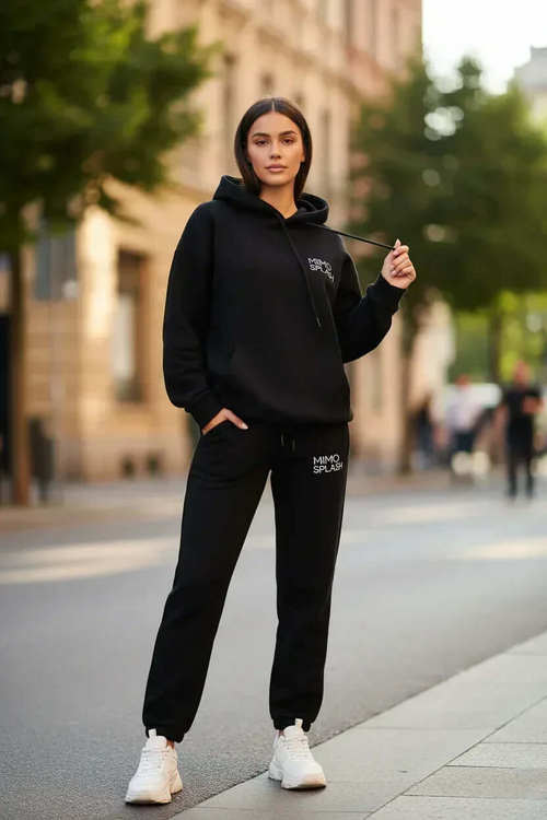 MIMOSPLASH Women's black hoodie jogger tracksuit set worn in an urban setting, showcasing modern streetwear style.